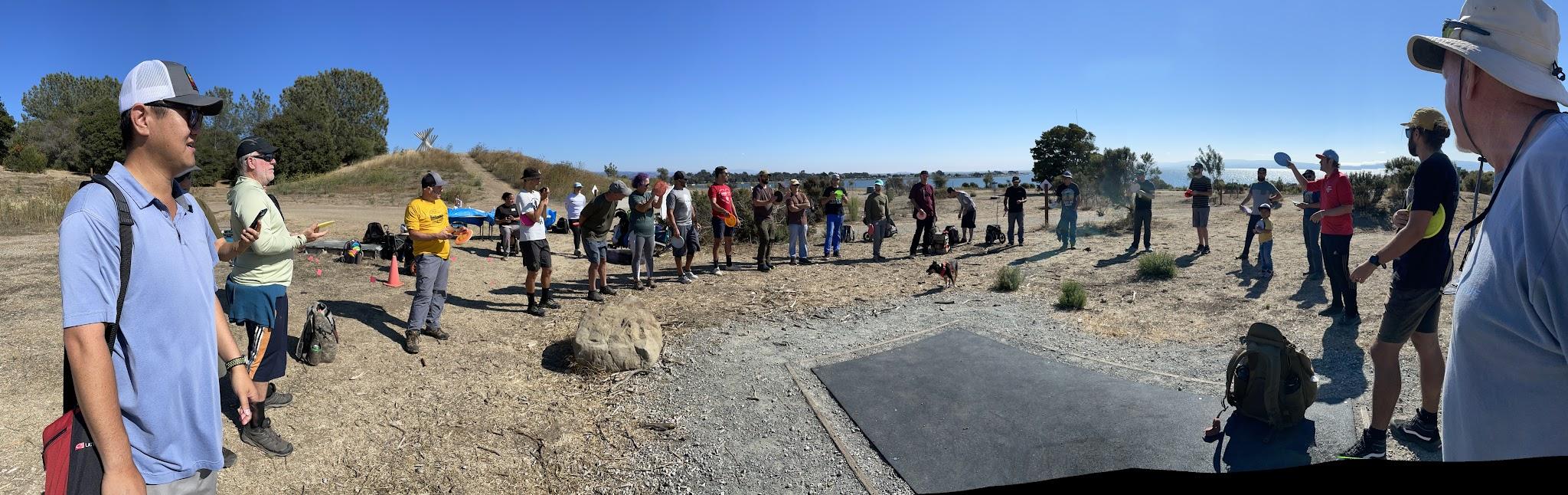 Oyster Bay players gathered together beside a tee for a club round